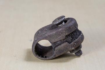 Old garden accessories. Rusty hose clamps on the workshop table.
