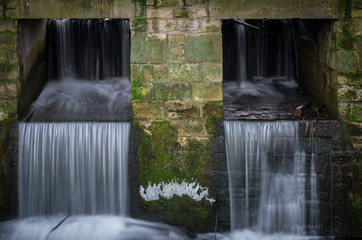 The waterfall out dam of city pond in Bueckeburg, Germany