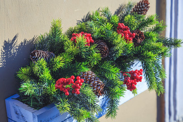 Fototapeta na wymiar Christmas decorations of firs and cones close-up