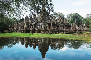 Fototapeta na wymiar Bayon temple in Angkor Wat reflections on water