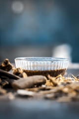 Ayurvedic herb Liquorice root,Licorice root, Mulethi or Glycyrrhiza glabra root and its powder with its tea for detoxifying the body, soothing spasms, easing menstrual cramps, raising blood pressure.