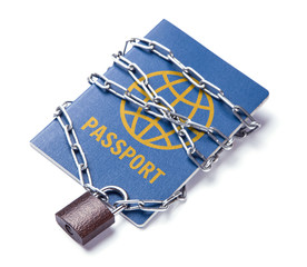 The blue passport is wrapped around the chain and locked. Ban on leaving the country for political reasons. Isolated on white background