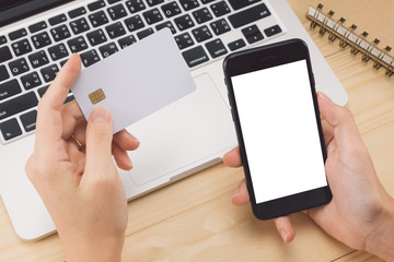 Hands using smart phone and credit card for online shopping concept