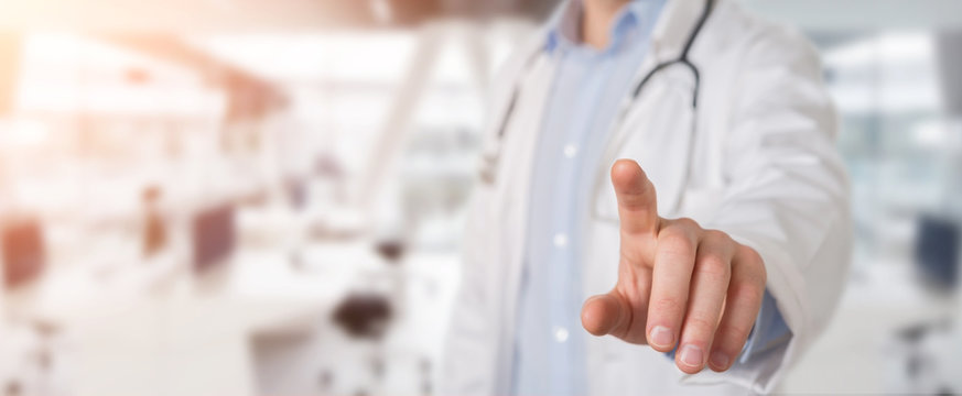 Doctor touching virtual interface with his finger