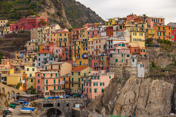 Fototapeta na wymiar Colorful houses in Manarola. Cinque Terre National park, Liguria, Italy