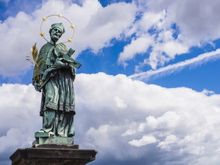 Fototapeta premium Bronze statue of Saint John of Nepomuk, Charles Bridge, Prague, Czech Republic 