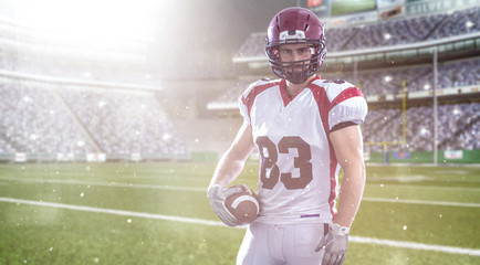 American Football Player isolated on big modern stadium field