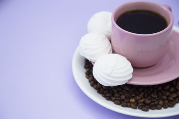 Coffee with sweets on light purple background