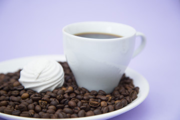 Coffee with sweets on light purple background