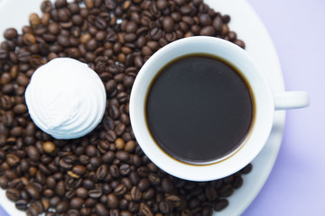 Coffee with sweets on light purple background