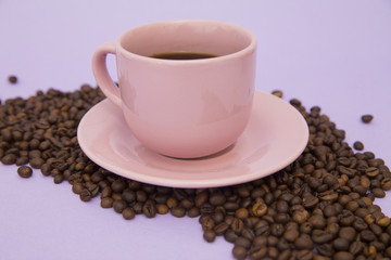 Coffee with sweets on light purple background