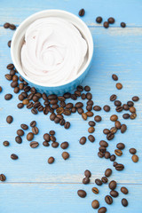 Coffee with sweets on a blue wooden background