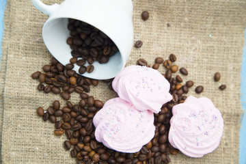 Coffee with sweets on a blue wooden background