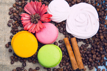Coffee with sweets on a blue wooden background