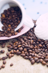 Coffee with sweets on a blue wooden background