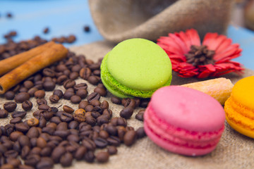 Coffee with sweets on a blue wooden background