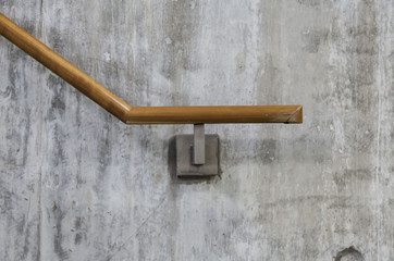 wood railing and concrete wall