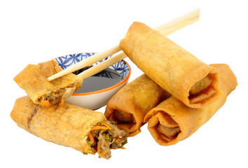 Chinese crispy duck filled spring rolls with soy sauce dip isolated on a white background