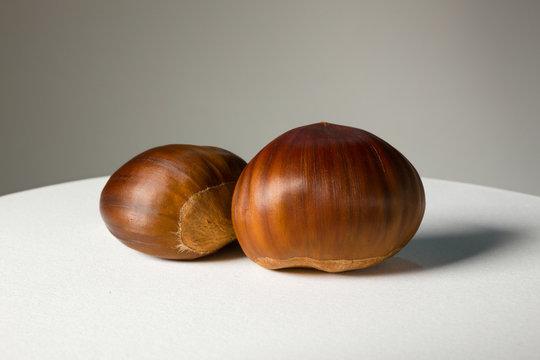 Still life of some chestnuts on a white background.