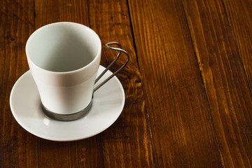 Empty coffee cup on wooden table