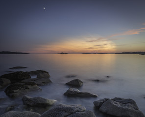 Obraz premium Moonset over sunset - landscape