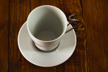 Empty coffee cup on wooden table