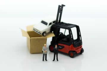 Miniature people : Man of auto insurance when an accident on the road. Image use for Make an agreement, responsibility, business concept.