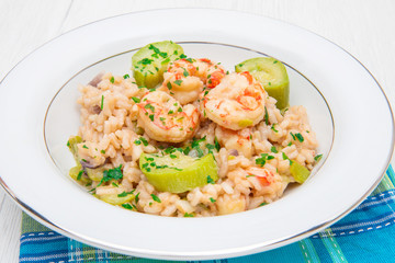 dish with risotto with prawns and zucchini