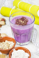 Healthy protein blueberry drink with oatmilk and nuts