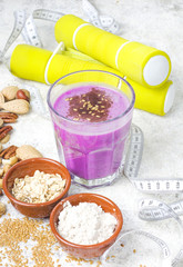 Healthy protein blueberry drink with oatmilk and nuts