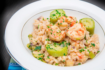 dish with risotto with prawns and zucchini