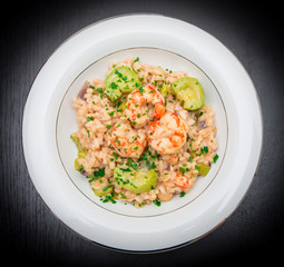 dish with risotto with prawns and zucchini