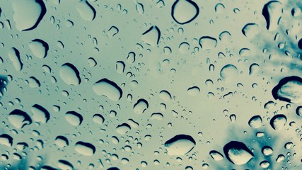 Drops of water on the windshield of a car
