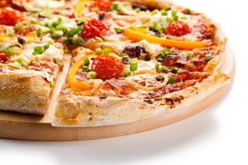 Pizza with ham and vegetables on white background 