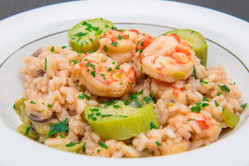 dish with risotto with prawns and zucchini