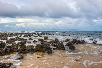 A tropical beach with rocks and waves justa before a stom - Natal-RN 