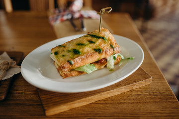 Hot sandwich grilled meat, lettuce. Bread with chicken and vegetables