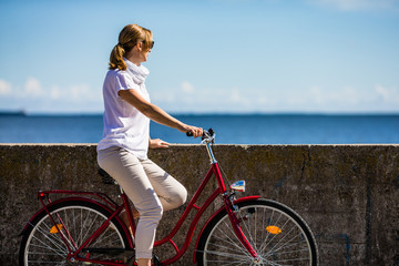 Woman and bike on pier