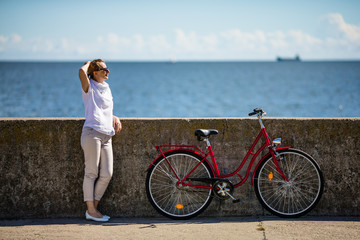 Woman and bike on pier