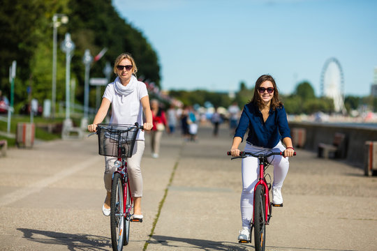 Women biking in city