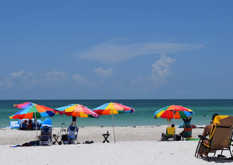 Beach with colorful umbrellas on a sunny day in Florida