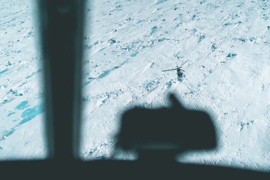 Air to Air View of Helicopter over the Ice - Antarctica