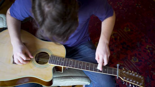 Looking straight down on a beater slide guitar with pvc sider.
