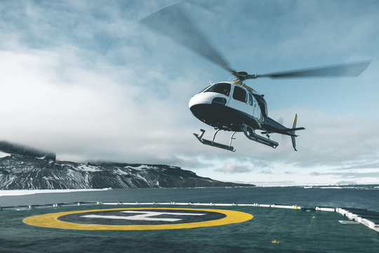Helicopter departing Expedition Vessel - Antarctica