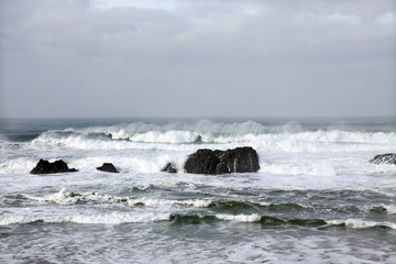 Sun sets below the horizon wit brilliant orange sky