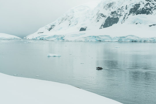 Rubber Dinghy cruising through the Ice - Antarctica