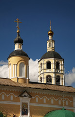Fototapeta na wymiar Breakthrough gate and bell tower of Monastery of St. Paphnutius - Pafnutyevo-Borovsky monastery in Borovsk. Kaluga oblast. Russia
