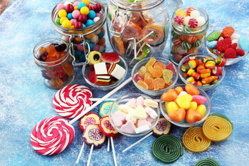 candies with jelly and sugar. colorful array of different childs sweets and treats.
