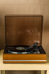 Vintage turntable playing a vinyl record