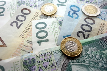 Polish zloty currency banknotes and coins, financial concept
